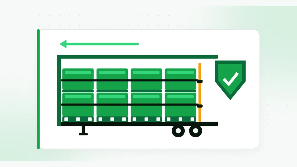 Illustration of a trailer cutaway with stacked pallets held by straps and an amber load bar, a forward-force arrow, and a green shield with a check mark